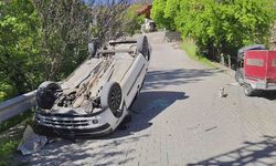 Ters dönen otomobilden yara almadan kurtuldu