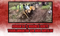 Korgan’da İş Makinesi Dereye Yuvarlanmaktan Son Anda Kurtuldu